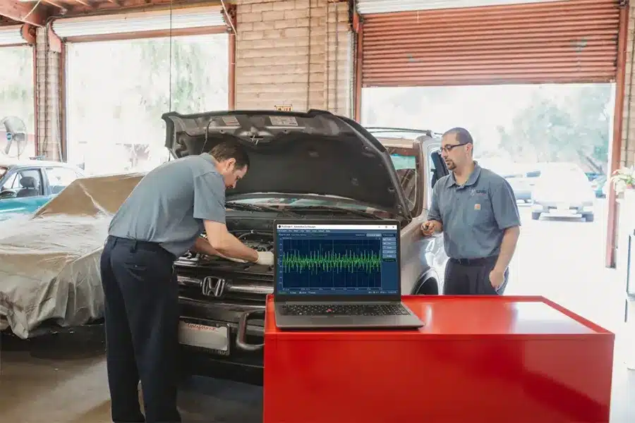 Car maintenance, auto repair in Walnut Creek, CA, at N Service Auto Repair and Service. Image of technicians diagnosing a Honda using advanced diagnostic equipment to identify engine performance issues.